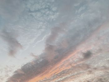 Low angle view of dramatic sky during sunset