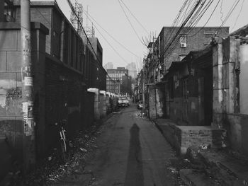 Street amidst buildings against sky