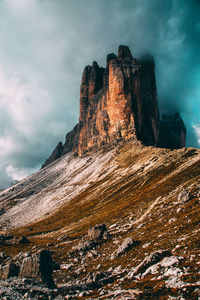 Low angle view of rock formation against sky