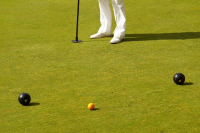 Low section of golfer playing on course