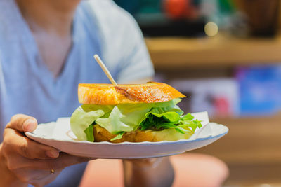 Midsection of woman having food