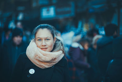 Portrait of woman wearing warm clothing while standing on street