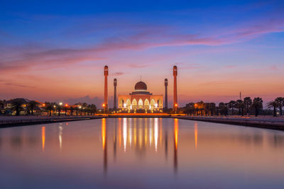 Illuminated masjid songkhla against sky during sunset