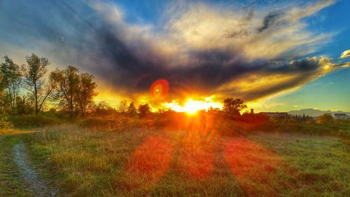 Scenic view of landscape against cloudy sky