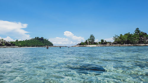 Scenic view of sea against blue sky