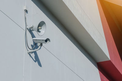 Low angle view of electric lamp on wall