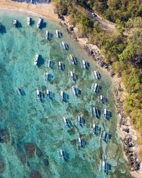 Aerial view of boats docked in a bay in bali, indonesia