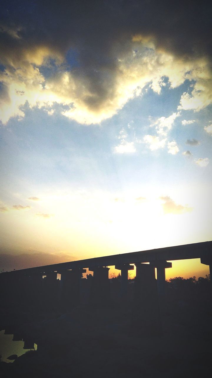 SILHOUETTE BRIDGE AGAINST SKY AT SUNSET