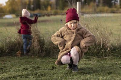 Full length of girl on field during winter