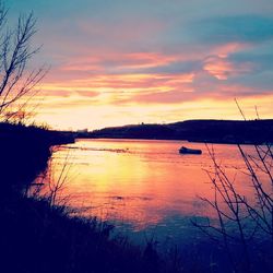 Scenic view of lake against sky during sunset