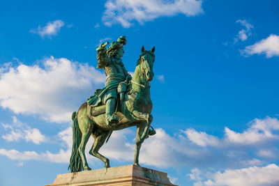 Low angle view of statue against sky