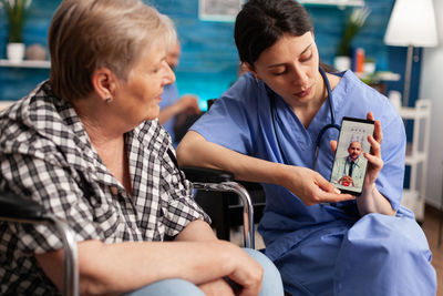 Doctor consulting patient via video call