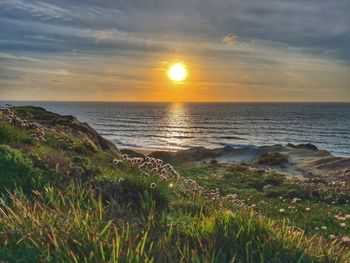 Scenic view of sea against sky during sunset