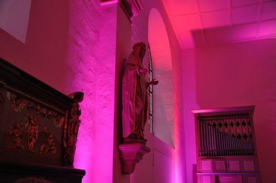 Low angle view of pink sculpture