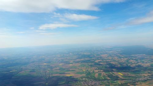 Aerial view of agricultural field against sky
