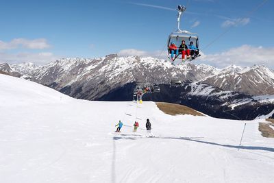 People skiing on snowcapped mountain