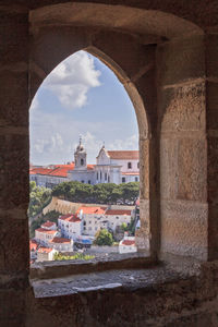 Cityscape seen through arch window