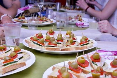 Close-up of hands preparing food on table