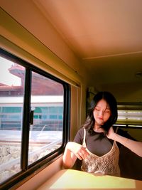 Young woman sitting in bus