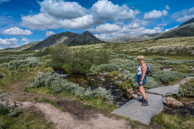 Female wander in landscape at peer gynt hytta, rondane nationalpark, høvringen