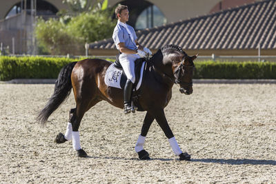 Full length of man riding horse