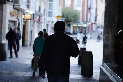 Rear view of woman standing in city