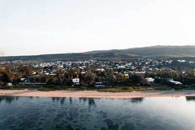 High angle view of townscape against sky and ocean