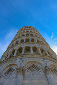 Low angle view of historical building against blue sky