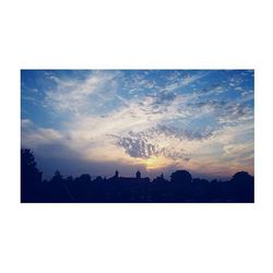 Silhouette of trees against sky at sunset