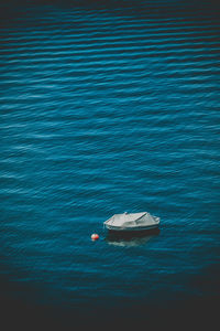 Boat moored in lake