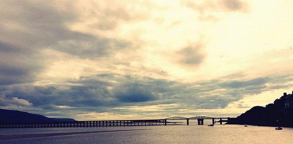 Scenic view of bridge over sea against sky