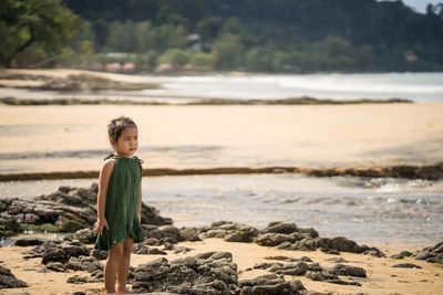 Portrait of girl standing on beach