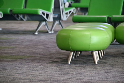 Close-up of empty chairs and table in cafe