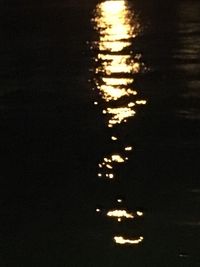 Defocused image of illuminated lights on beach at night