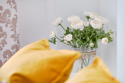 Close-up of white rose flower vase