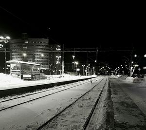 Railroad tracks in winter at night