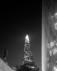 Low angle view of skyscrapers lit up at night