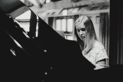 Young woman playing piano