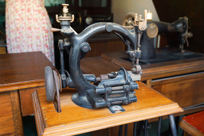 Close-up of machinery on wooden table