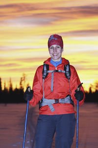 Woman skiing at sunset