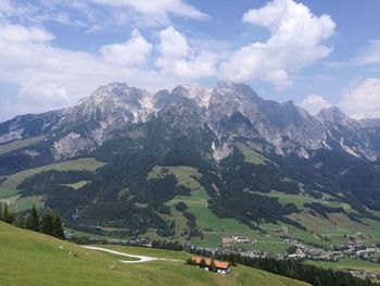 Scenic view of landscape and mountains against sky