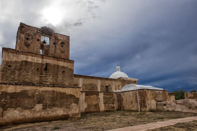 View of historic building against cloudy sky