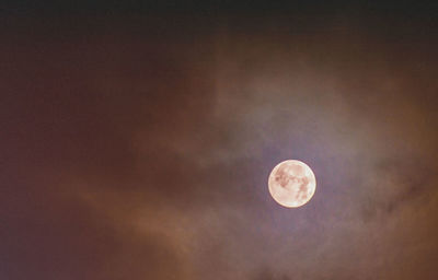 Low angle view of moon against sky at night