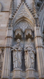 Low angle view of statue against temple