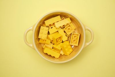 Close-up of yellow cake on white background