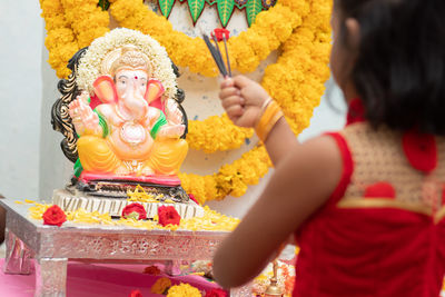 Low angle view of female statue at temple