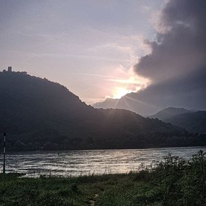 Scenic view of lake against sky during sunset