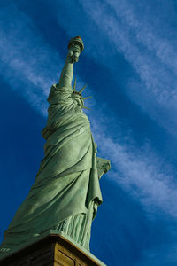 Low angle view of statue against blue sky