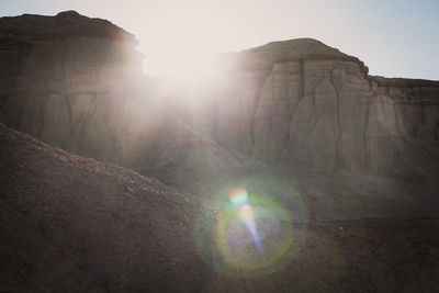 Sun shining through rock formations