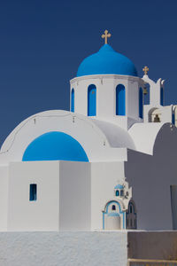 Low angle view of church against clear blue sky